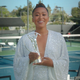 Naomi Osaka holding an award